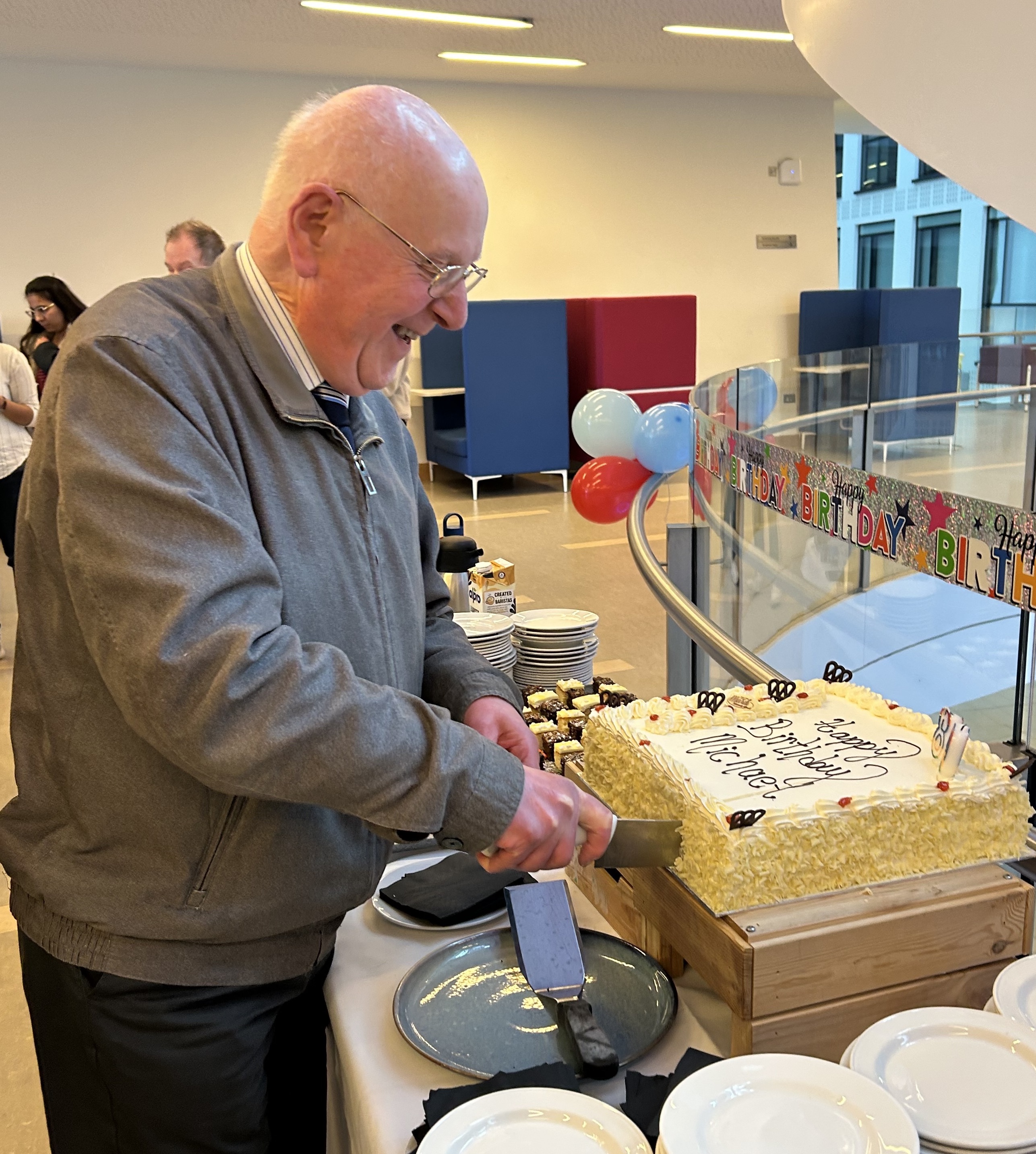 Man cutting birthday cake